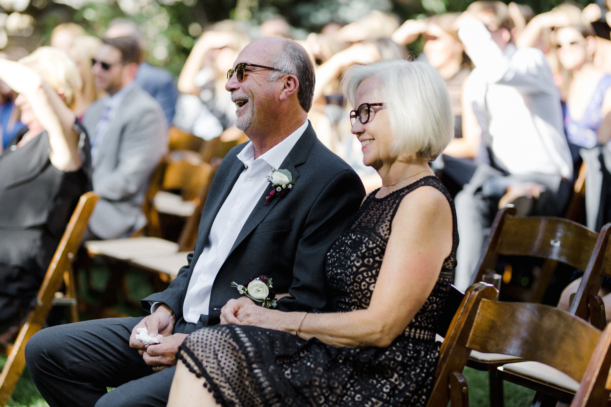 Parents Laughing at Ceremony.
