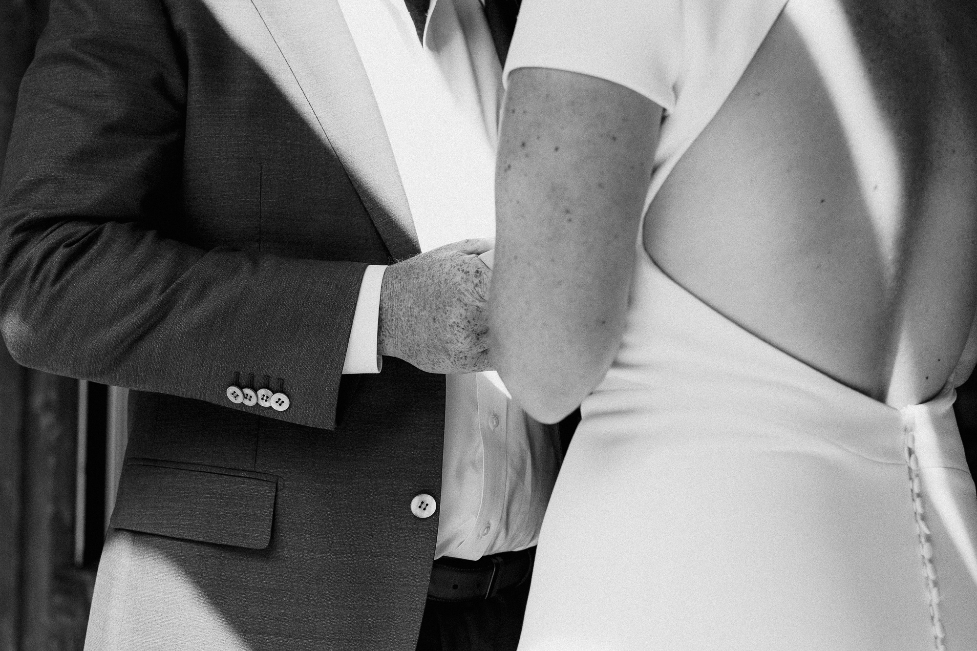 Bride and Groom Holding Hands.