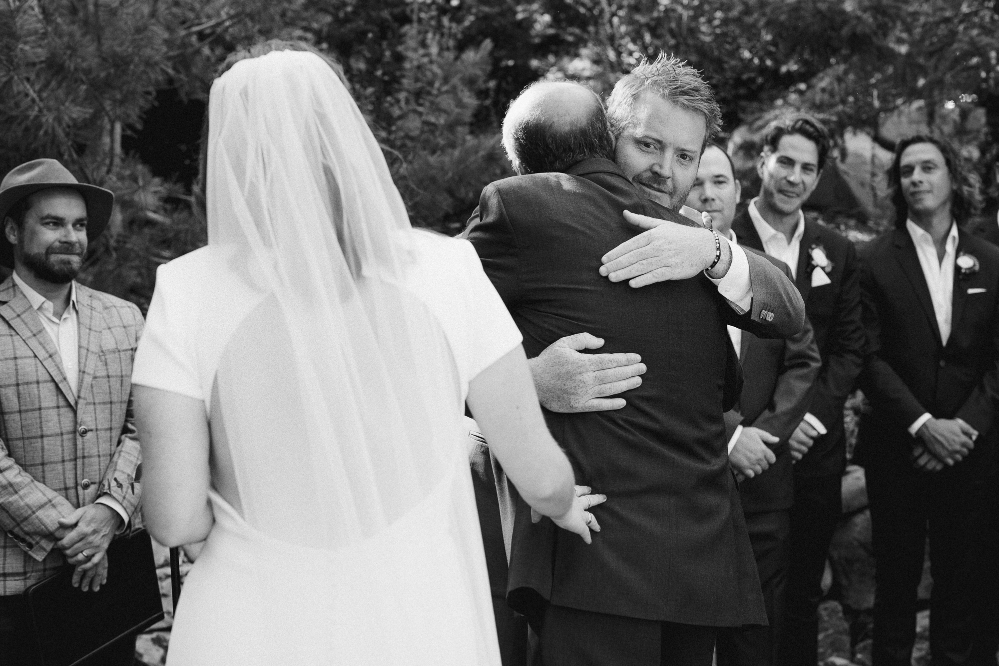 Groom Hugging Father In Law.
