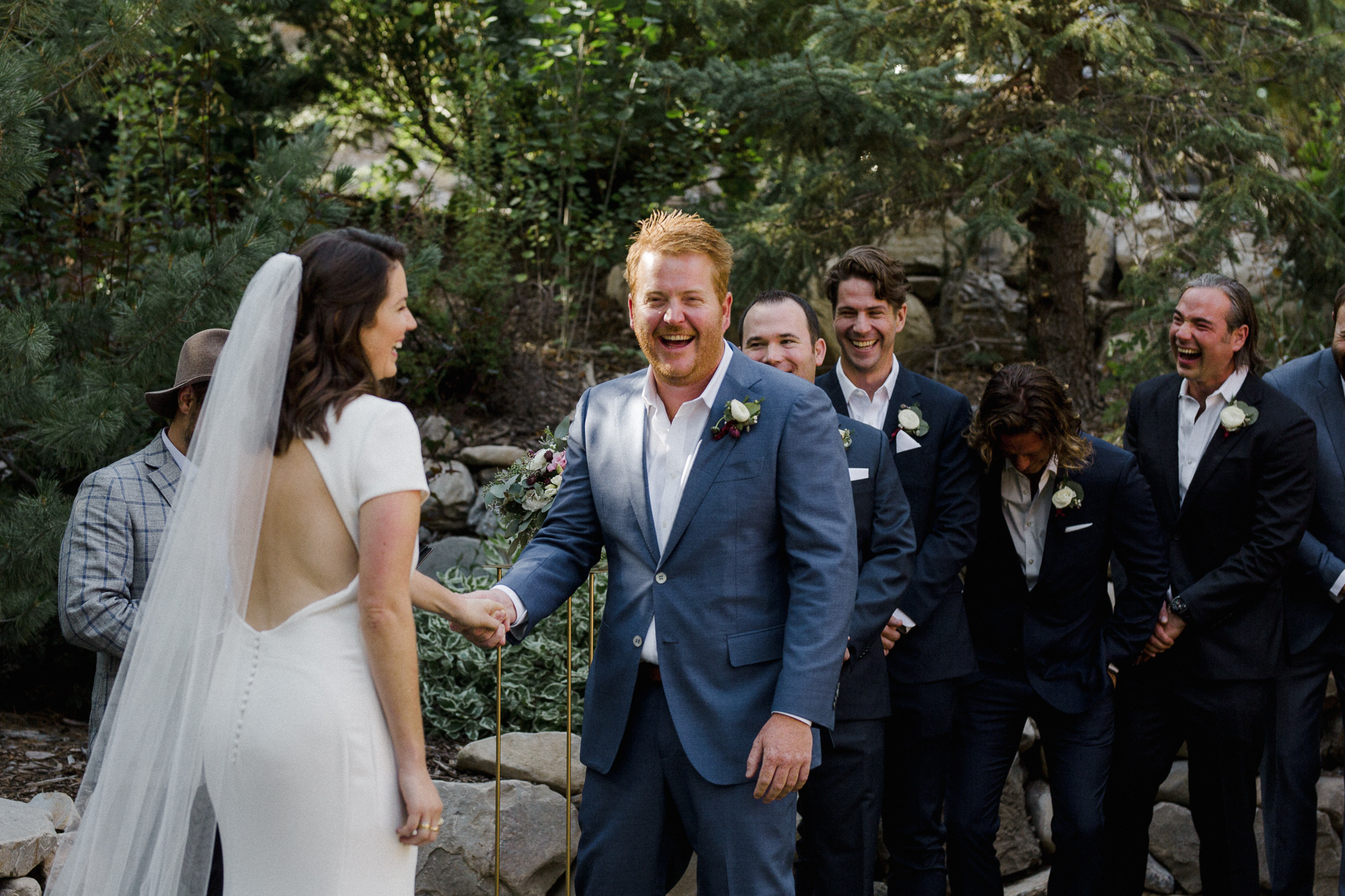 Groom Laughing at Ceremony.