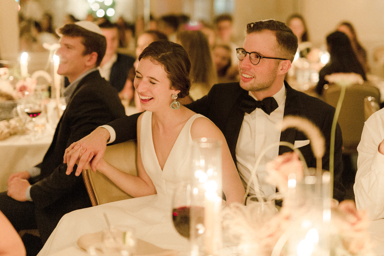 bride-and-groom-laughing-at-dinner