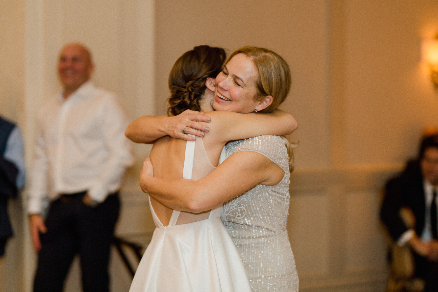 bride-hugging-mom-reception