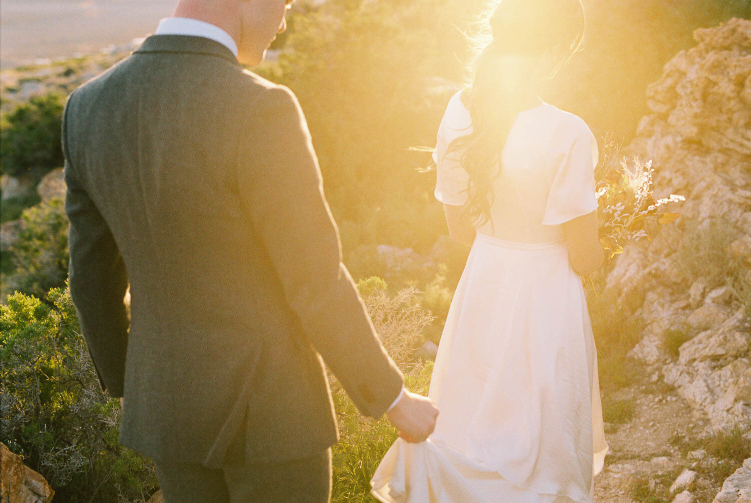 bride-groom-walking-sunset