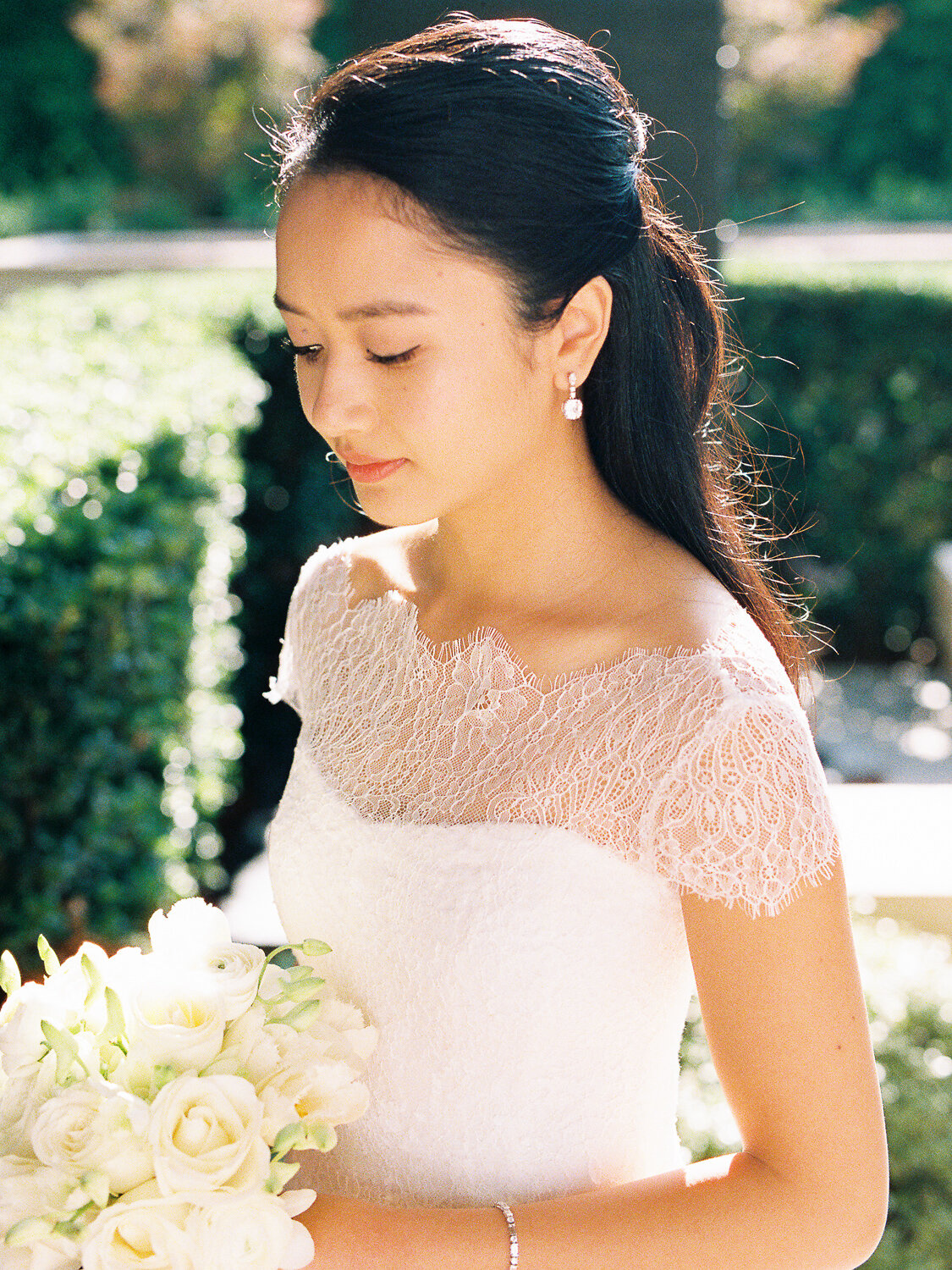 bride-looking-at-flowers
