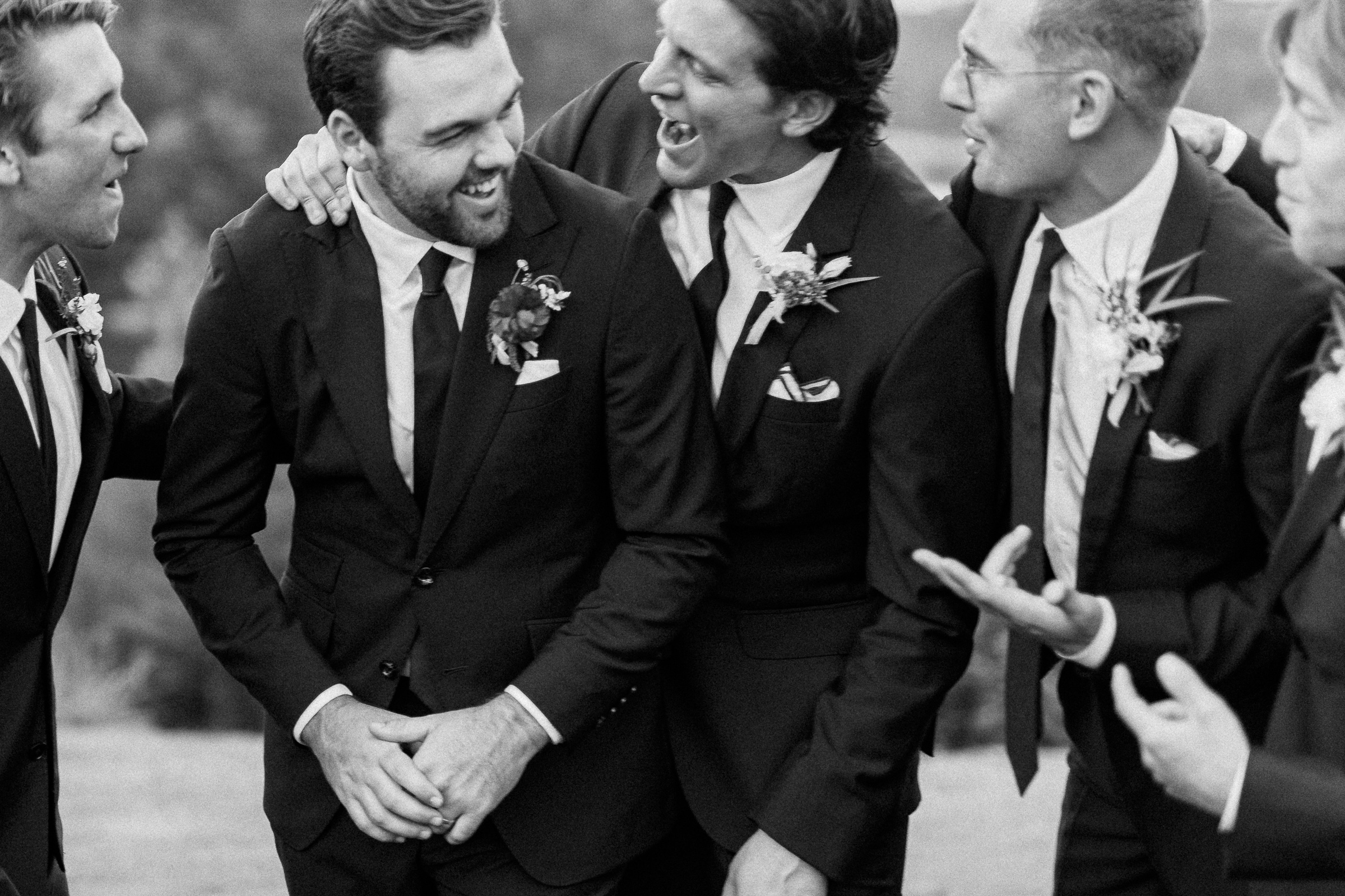 groom laughing with groomsman