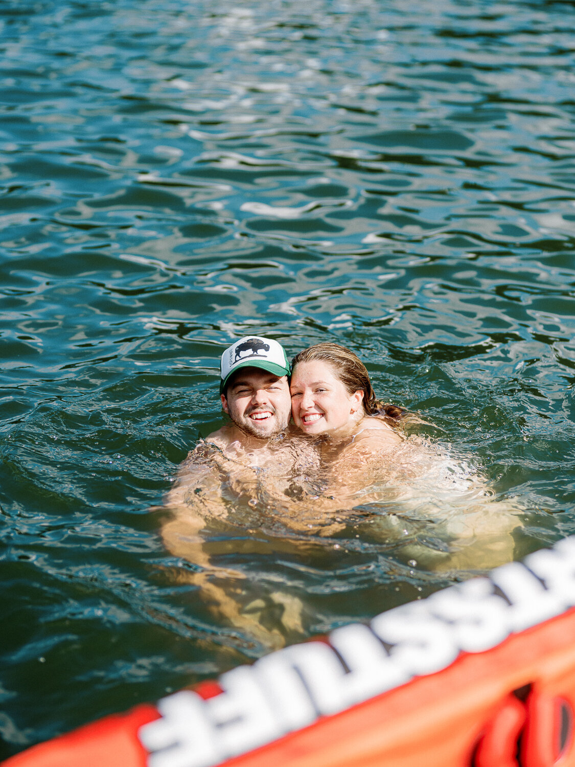 bride and groom swimming